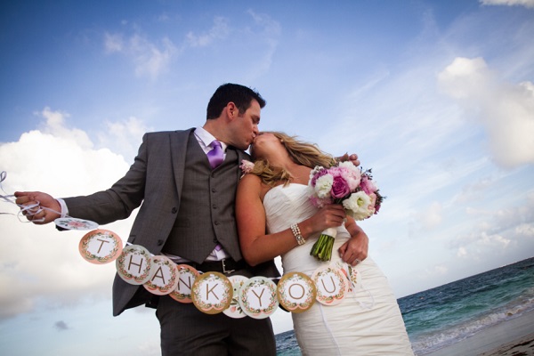 Destination Wedding Bride and Groom holding thank you sign