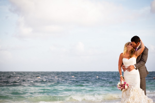 Destination Wedding Bride and Groom kissing on the beach, Dreams Riviera Cancun
