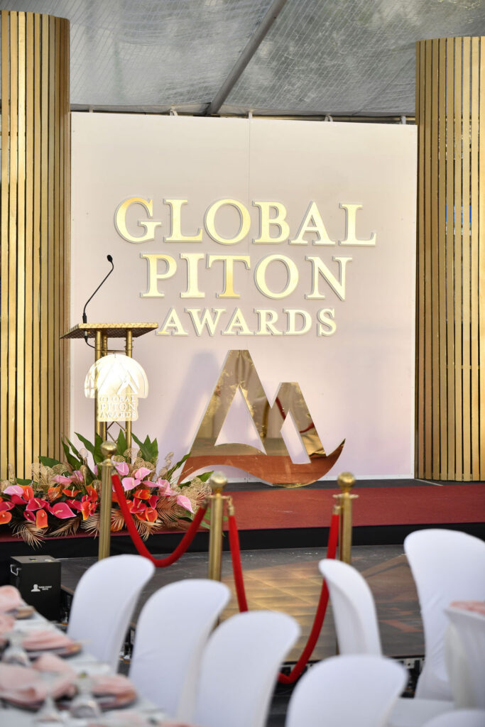 Attendees posing in front of the Global Piton Awards 2026 event backdrop.
